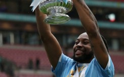 Antoine Semenyo holds aloft the FA Cup. His goal secured Manchester City a 1-0 win over Chelsea at Wembley