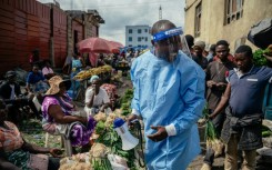 Cousin Kasumbo of the U Report Goma group, explains Ebola to traders in eastern DRC