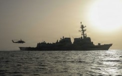 An MH-60R Sea Hawk, assigned to Helicopter Maritime Strike Squadron (HSM) 50, taking off of the flight deck of Arleigh Burke-class guided-missile destroyer USS Thomas Hudner