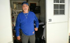 Michael Reyes poses inside a so-called tiny home in the Eagle Rock neighborhood of Los Angeles, California on June 1, 2026.
