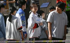 Some students were still cramming as they waited in line to sit the exam