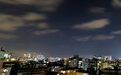 Rocket trails are seen above the Israeli coastal city of Netanya, as air raid sirens sounded in the country to warn of incoming Iranian missiles for the first time since an April 2026 ceasefire took hold in the Middle East war