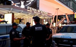 NYPD police officers are seen outside Penn Station in New York on June 7, 2026, after a stabbing attack inside the transit center