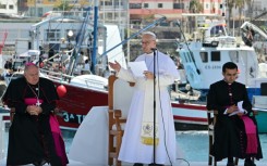 Pope Leo XIV delivers a speech during a meeting with organizations working with migrants in the port of Arguineguin on the Canary Island of Gran Canaria, a place accustomed to the arrival of migrants