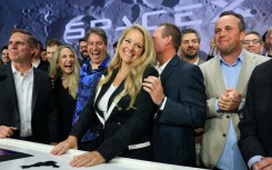 SpaceX president and chief operating officer Gwynne Shotwell (C) celebrates with SpaceX employees and executives