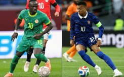 Senegalese journalists will be thinner on the ground for the World Cup duel between Senegal icon Sadio Mane (L) and French superstar Kylian Mbappe (R)owing to visa problems