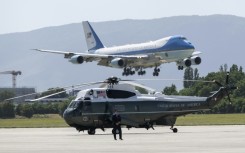 Air Force One carrying US President Donald Trump lands at the Geneva Airport with Marine One helicopter in the foreground ahead of the G7 summit