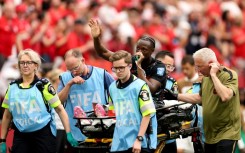 Canada's Ismael Kone waves to the crowd after suffering a serious injury in the 6-0 win over Qatar