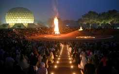 Huge draw: visitors and residents at a bonfire celebration near the 'Temple of the Mother' in India's Auroville spiritual community