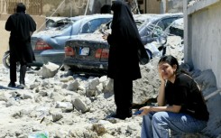 A woman weeps at the site of an Israeli airstrike that targeted the southern Lebanese village of Qennarit on June 20, 2026