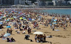 People packed beaches in Portugal and Spain, such as this one in San Sebastian