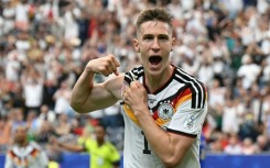 Nico Schlotterbeck celebrates after scoring against Curacao at the World Cup