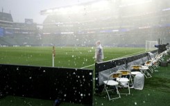 The rain pours onto the World Cup stadium in Philadelphia, forcing France's game against Iraq to be suspended for more than two hours