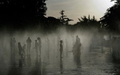 People off in a water fountain in Spain