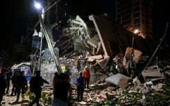 Rescuers searched rubble collapsed buildings for survivors in Caracas following massive twin earthquakes in Venezuela