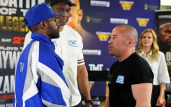 US boxer Floyd Mayweather Jr., left, and Greek kickboxer Mike Zambidis, right, reportedly will not fight on Saturday in an exhibition at Athens as originally announced