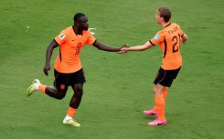 Dutch forward Brian Brobbey (left) celebrates scoring against Tunisia in their World Cup Group F match in Kansas City