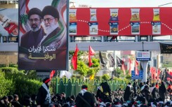 A billboard in Beirut depicts slain Ayatollah Ali Khamenei and his son, Mojtaba Khamenei