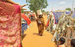 Displaced residents of southern Kordofan must walk long distances to find water during fighting between the government army and the paramilitary Rapid Support Forces