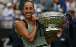 Madison Keys poses with the trophy after beating Tatjana Maria in the Eastbourne final