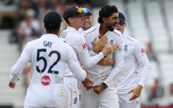 England off-spinner Shoaib Bashir (2R) celebrates with teammates after trapping New Zealand's Rachin Ravindra lbw in the third Test at Trent Bridge