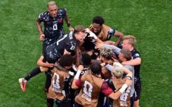 Canada's bench streamed onto the pitch as the stadium eruped