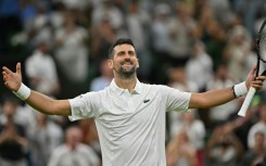 Serbia's Novak Djokovic celebrates beating China's Wu Yibing.