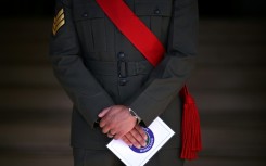 A member of the military stands guard on the first day of the 2026 Wimbledon Championships