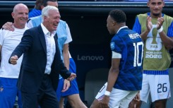 Kylian Mbappe celebrates with France coach Didier Deschamps