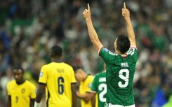 Mexico forward Raul Jimenez celebrates scoring against Ecuador in the World Cup round of 32 at the Azteca Stadium