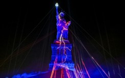 The Statue of Liberty is illuminated during the "Liberty Lights" event celebrating the 250th anniversary of US independence
