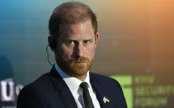 Britain's Prince Harry is due to arrive back in the UK, but without his wife, Meghan, and two children as had originally been planned
