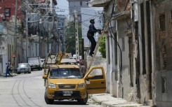 An electrician works on the power grid in Havana during a nationwide power outage in Cuba, the third in six months