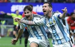 Lionel Messi celebrates scoring Argentina's second goal