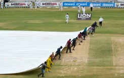 Ground staff pull on the covers during the fifth and final day of the second Test between Sri Lanka and West Indies