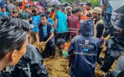 Heavy rain in Bangladesh triggered a landslide at the world's largest refugee camp that killed seven children and a teacher during a school class