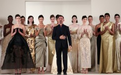 Syrian fashion designer Rami Al Ali with models at the end of his show