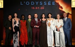 The cast of "The Odyssey" pose with director Christopher Nolan (right) at the Paris premiere