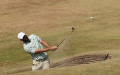 Scottie Scheffler plays from a bunker during practice for the British Open at Royal Birkdale