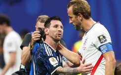 Lionel Messi with England captain Harry Kane