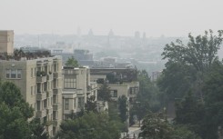 View of downtown Washington, seen from Malcolm X Park, on July 17, 2026 as smoke from Canadian wildfires engulfs the US capital