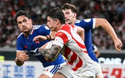 Japan's Dylan Riley makes a run against France in Tokyo during his side's 42-15 defeat