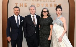 The epic film, directed by Christopher Nolan (middle left) and produced by his wife Emma Thomas (center right), features an ensemble cast including Matt Damon (L) and Anne Hathaway (R)