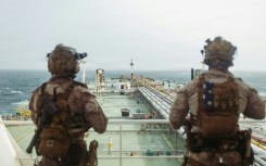 This handout photograph taken on July 16, 2026 by US Central Command Public Affairs shows US Marines from the 11th Marine Expeditionary Unit conducting a verification boarding aboard the M/T Wen Yao in the Gulf of Oman