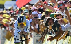 Remco Evenepoel crosses the finish line in a winning time in Thonon-les-Bains