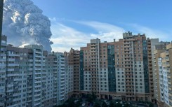 Smoke rises into the sky over residential buildings in Saint Petersburg on July 24, 2026