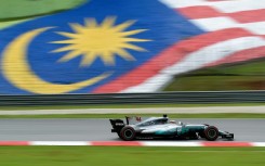 Lewis Hamilton races at the 2017 Malaysian Grand Prix while driving for Mercedes