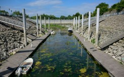 Boats stranded in shallow water in the tourist port in Corabia, southern Romania