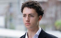French teenager Didier Gaspard Owen Maximilien arrives at the State Courts in Singapore on July 30, 2026