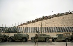 Spain rushed troops, more police, drones, divers and boats to Ceuta